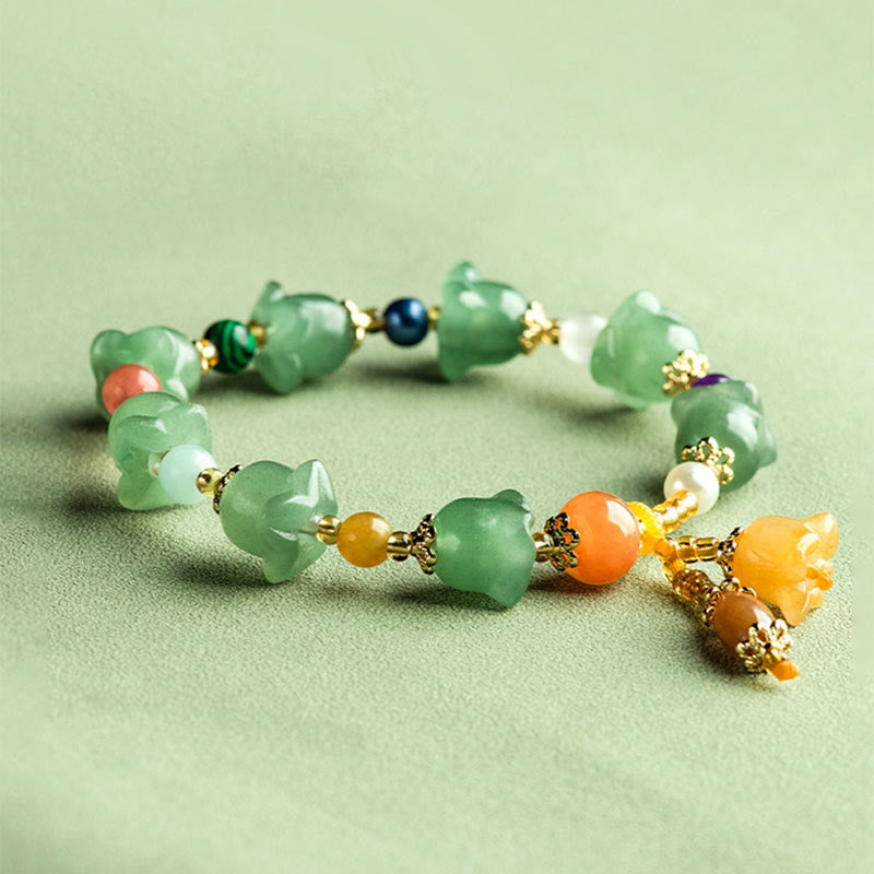 Bracelet porte-bonheur en aventurine verte et fleur de magnolia