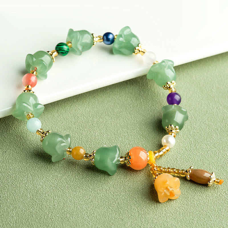 Bracelet porte-bonheur en aventurine verte et fleur de magnolia