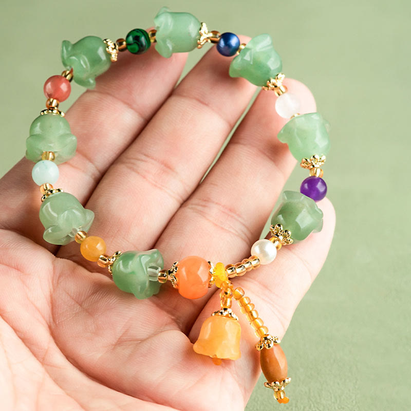Bracelet porte-bonheur en aventurine verte et fleur de magnolia