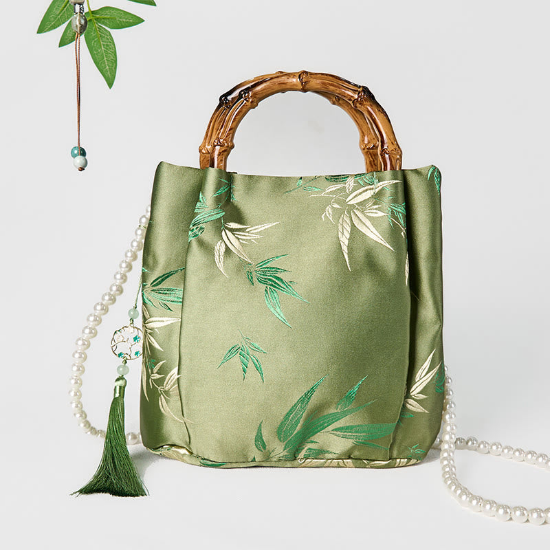 Sac bandoulière en perles avec poignée en bambou vert et broderie de feuilles