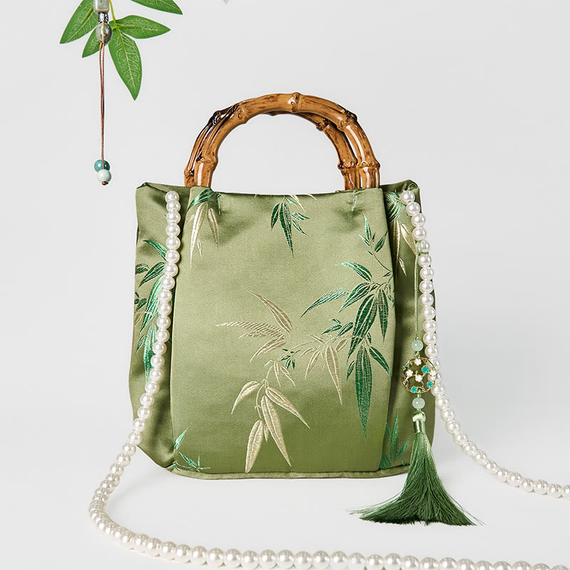 Sac bandoulière en perles avec poignée en bambou vert et broderie de feuilles