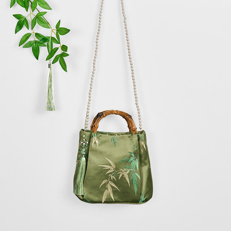 Sac bandoulière en perles avec poignée en bambou vert et broderie de feuilles