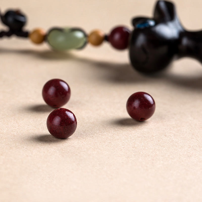 Porte-clés avec boucle de paix en bois de santal vert et ébène