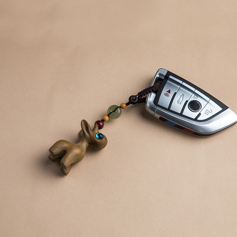 Porte-clés avec boucle de paix en bois de santal vert et ébène