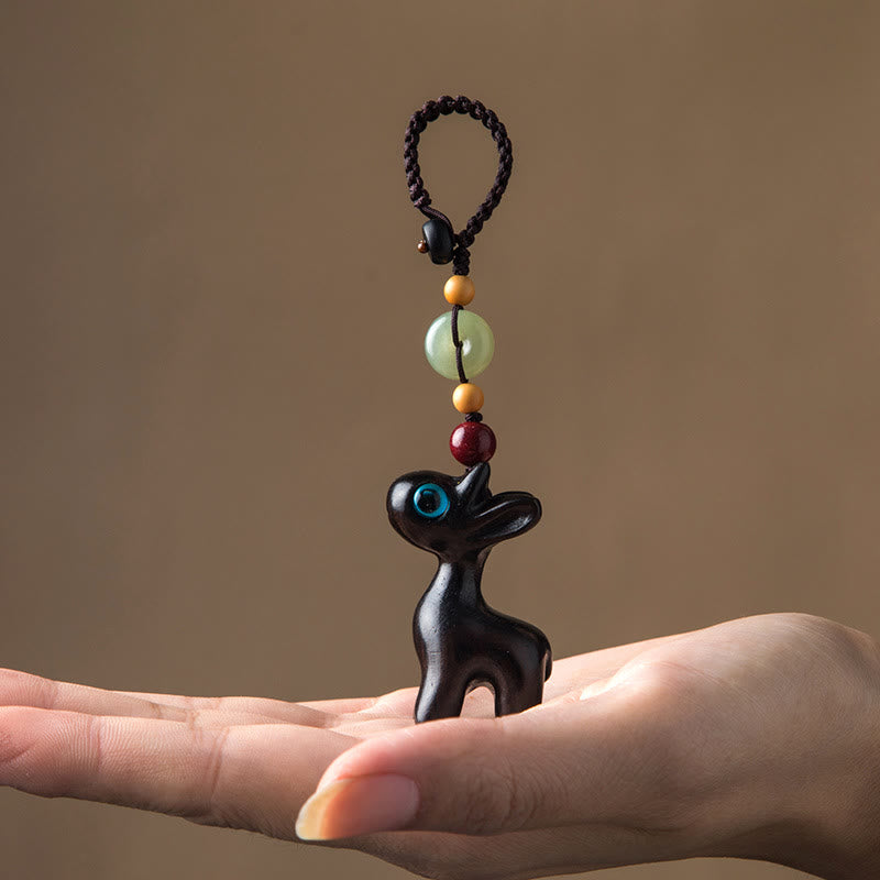 Porte-clés avec boucle de paix en bois de santal vert et ébène