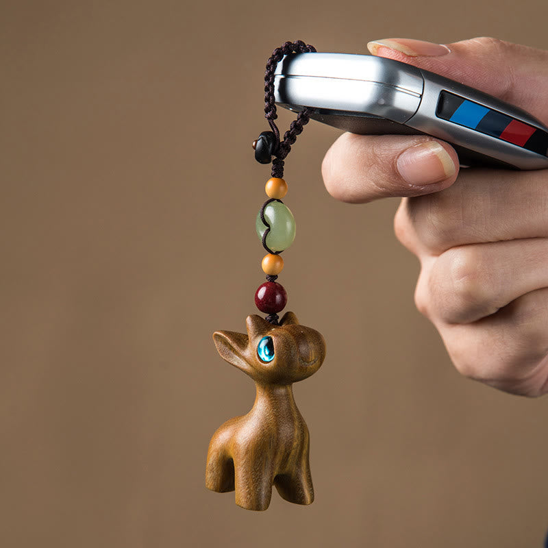 Porte-clés avec boucle de paix en bois de santal vert et ébène