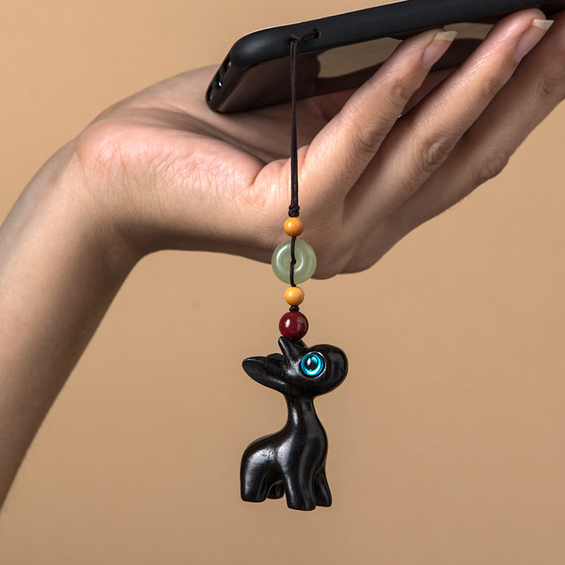 Porte-clés avec boucle de paix en bois de santal vert et ébène