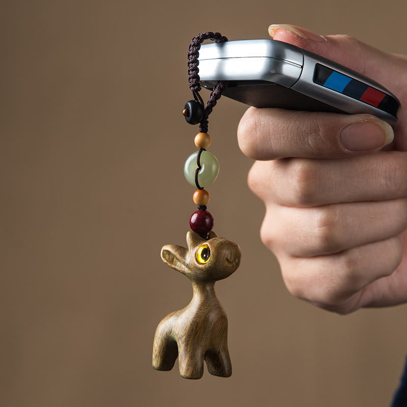 Porte-clés avec boucle de paix en bois de santal vert et ébène