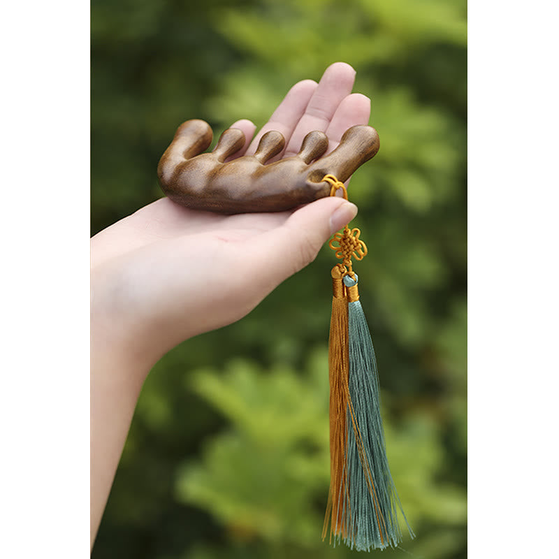 Peigne de massage à pompon en bois de santal vert pour une relaxation apaisante