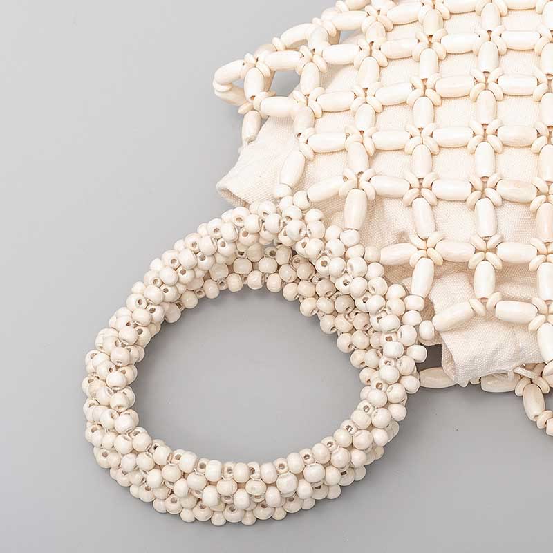Sac à bijoux spirituel en perles de bois losangées tissées à la main