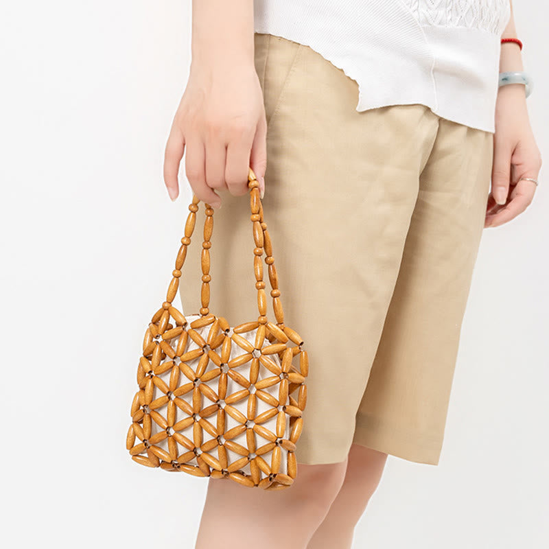 Sac à bijoux spirituel en mini perles de bois tissées à la main