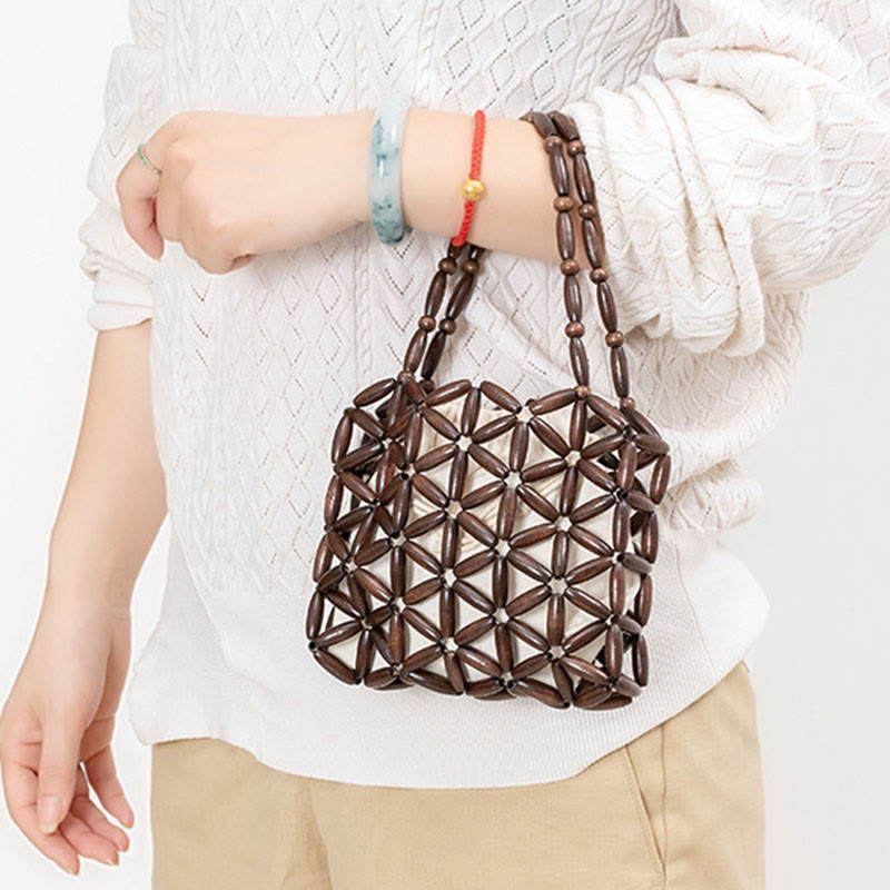 Sac à bijoux spirituel en mini perles de bois tissées à la main