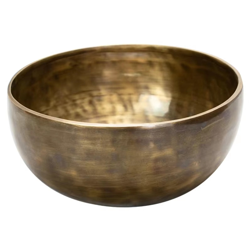 Hammered brass singing bowl with smooth rim and textured interior for meditation