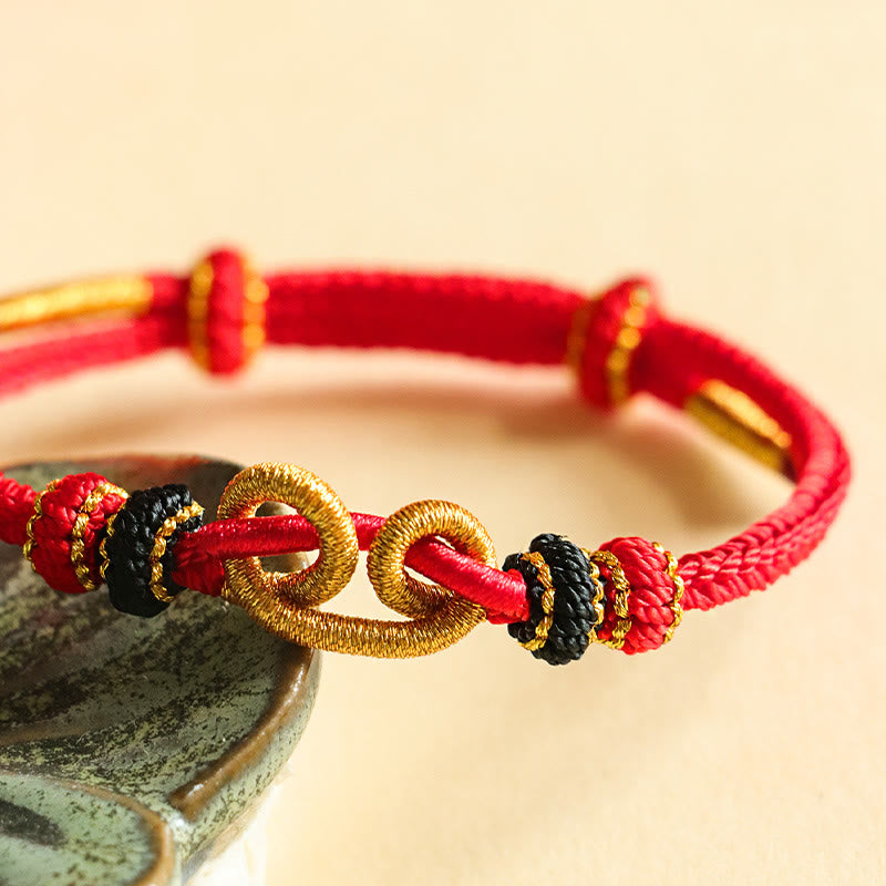 Bracelet de protection en fil rouge fait main avec motif lingot