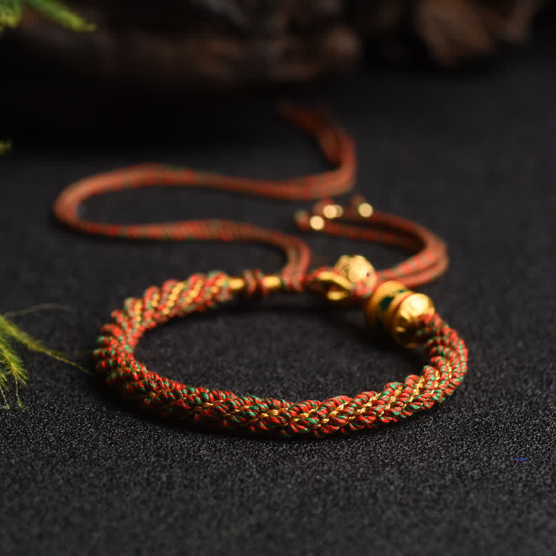 Bracelet tibétain fait main avec roue de prière porte-bonheur en fil rouge