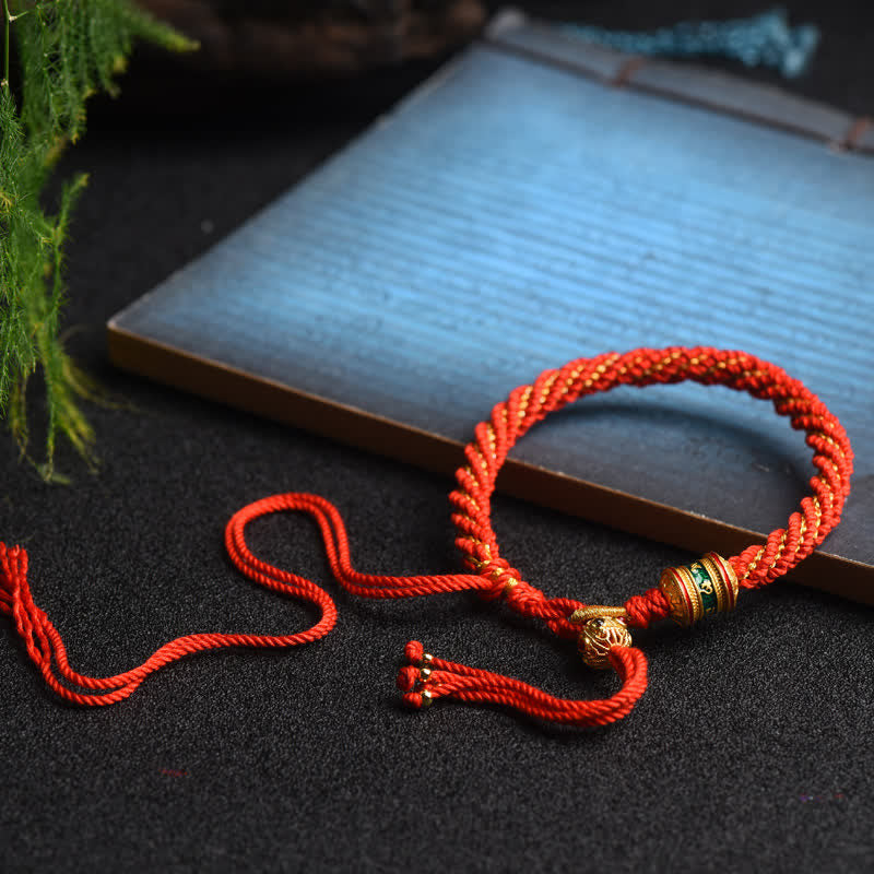 Bracelet tibétain fait main avec roue de prière porte-bonheur en fil rouge