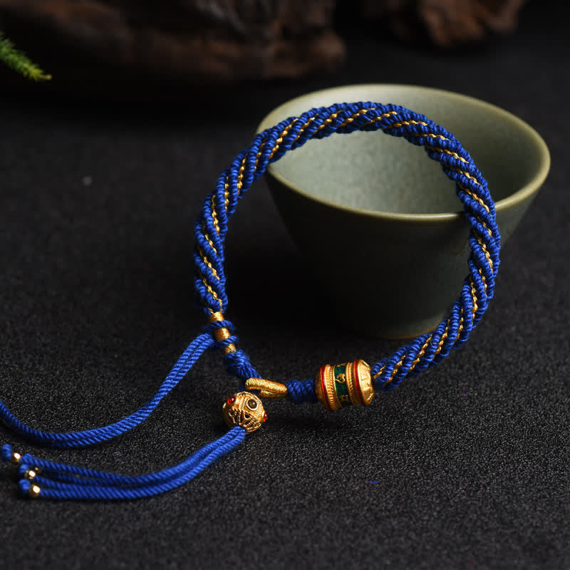 Bracelet tibétain fait main avec roue de prière porte-bonheur en fil rouge