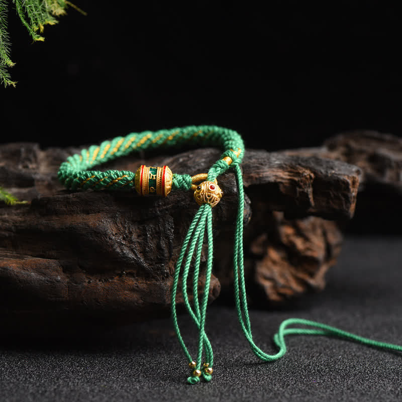 Bracelet tibétain fait main avec roue de prière porte-bonheur en fil rouge