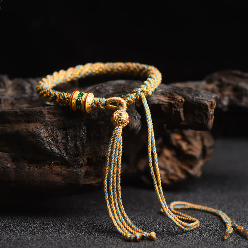 Bracelet tibétain fait main avec roue de prière porte-bonheur en fil rouge