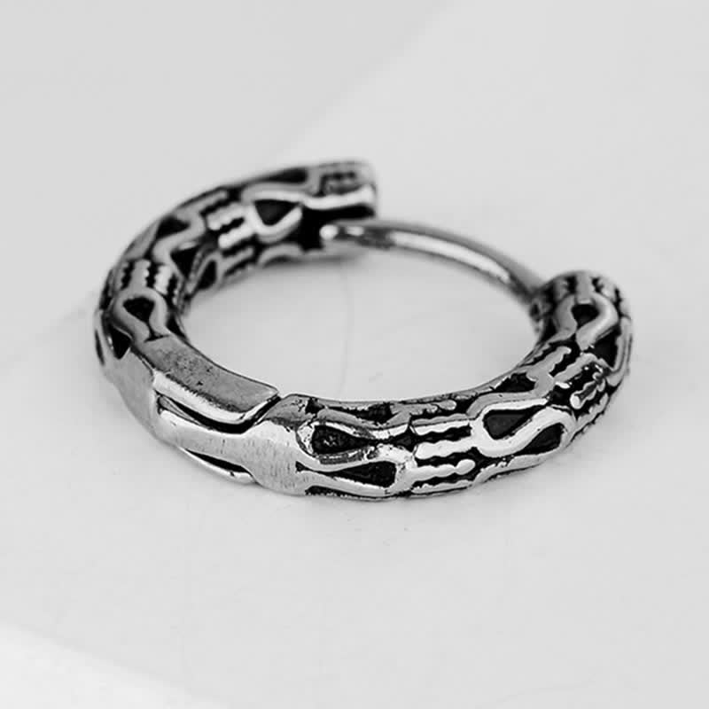 Boucles d'oreilles en acier titane faites à la main pour l'harmonie intérieure