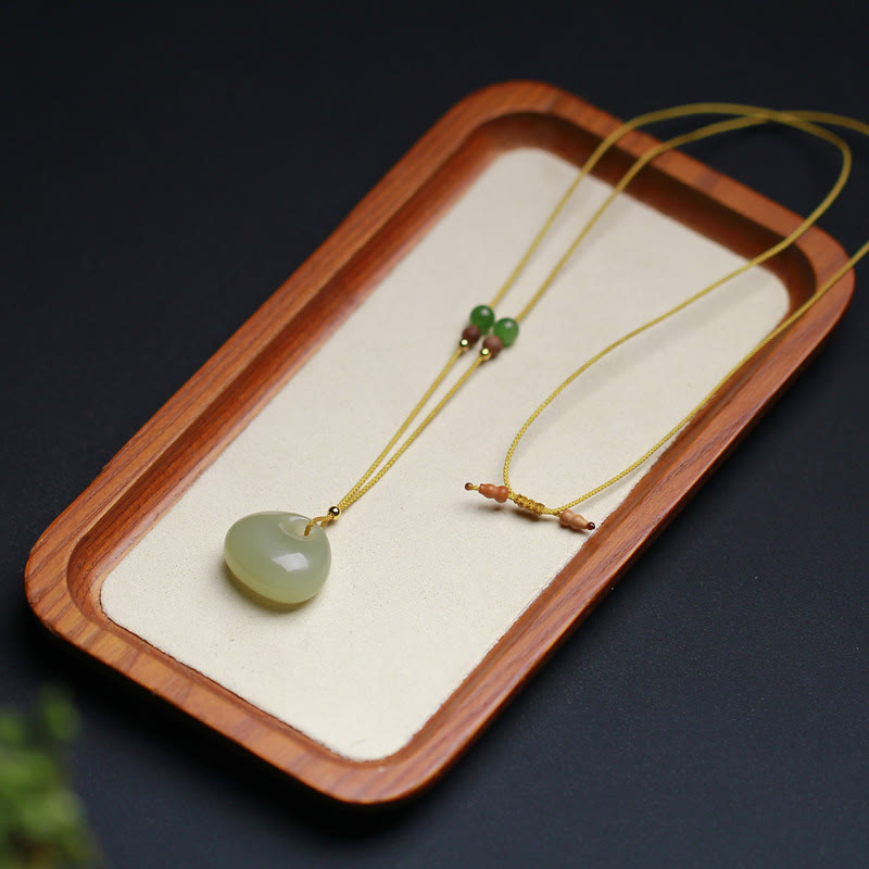 Collier pendentif prospérité en jade Hetian | Modèle petit sac