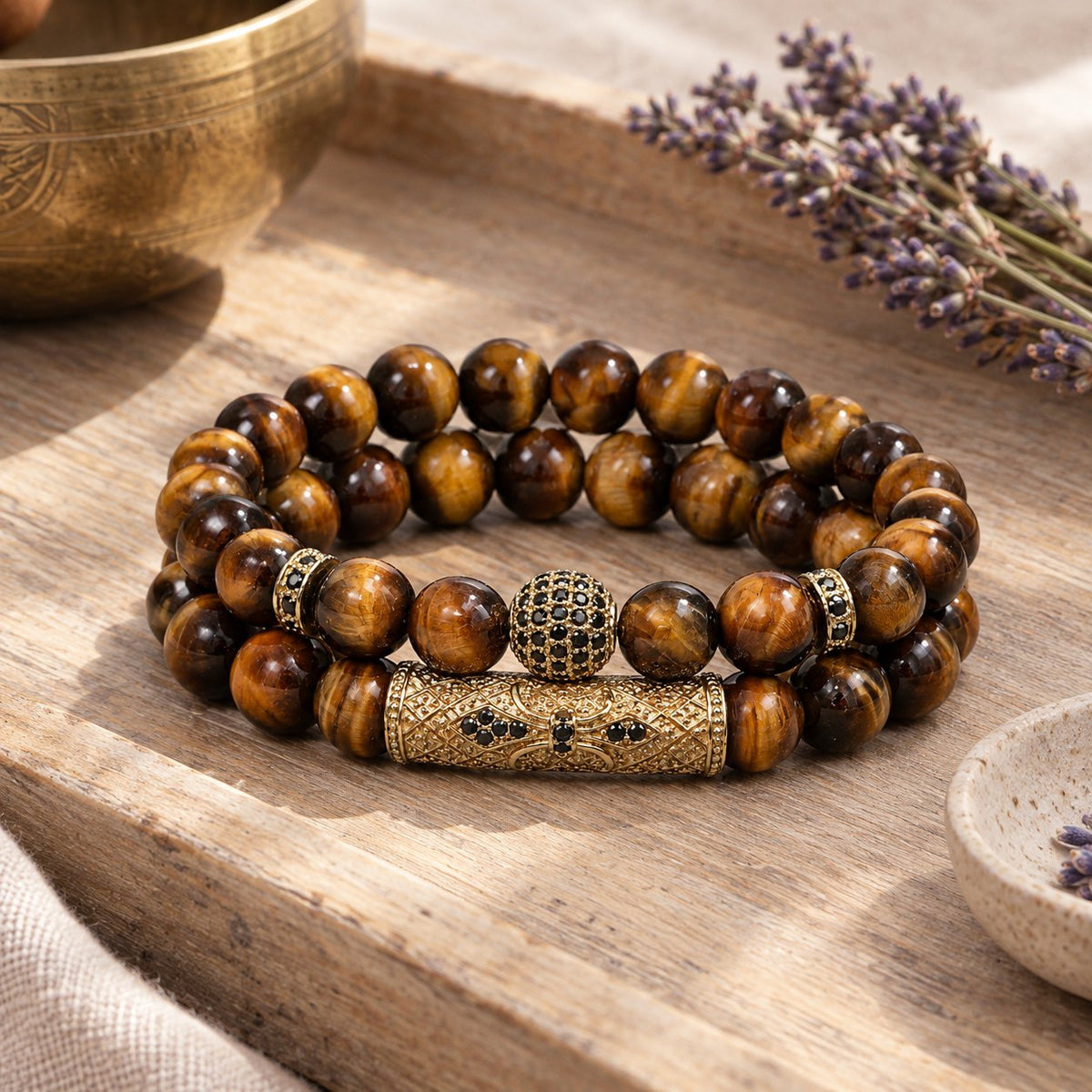 Tiger Eye & Black Agate Beaded Bracelets, styled with a singing bowl and lavender
