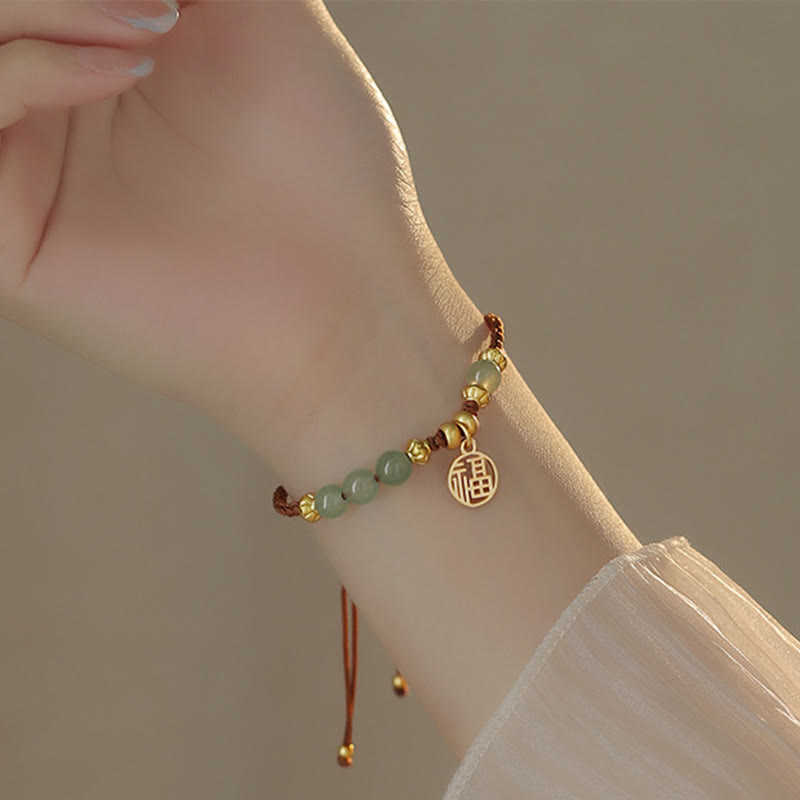 Bracelet en perles de jade avec le personnage Fu pour la prospérité et la chance