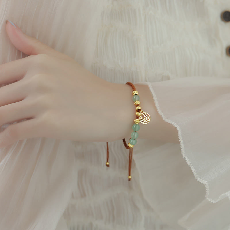 Bracelet en perles de jade avec le personnage Fu pour la prospérité et la chance