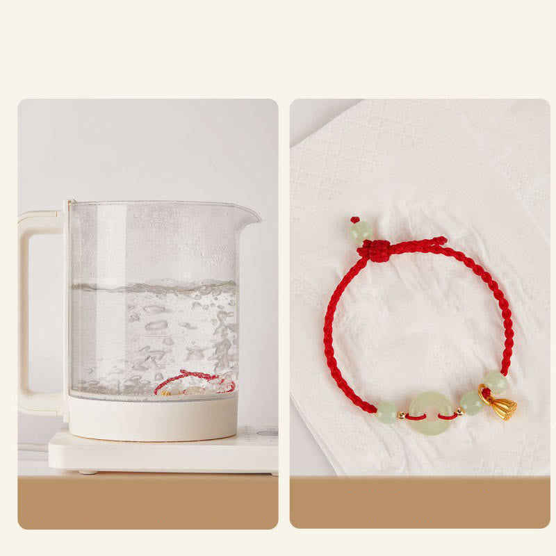 Bracelet en fil de jade et lotus de paix pour l'abondance