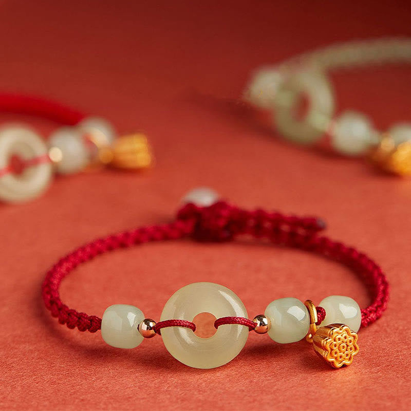Bracelet en fil de jade et lotus de paix pour l'abondance