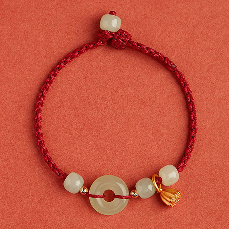 Bracelet en fil de jade et lotus de paix pour l'abondance