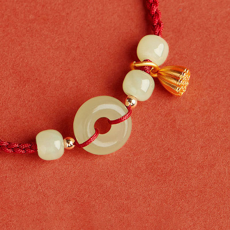 Bracelet en fil de jade et lotus de paix pour l'abondance