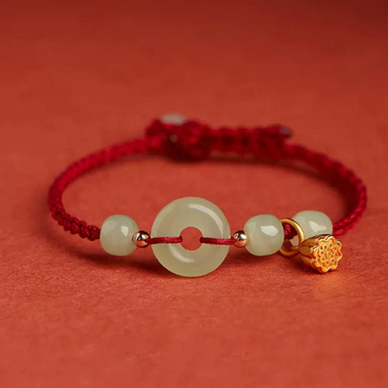 Bracelet en fil de jade et lotus de paix pour l'abondance