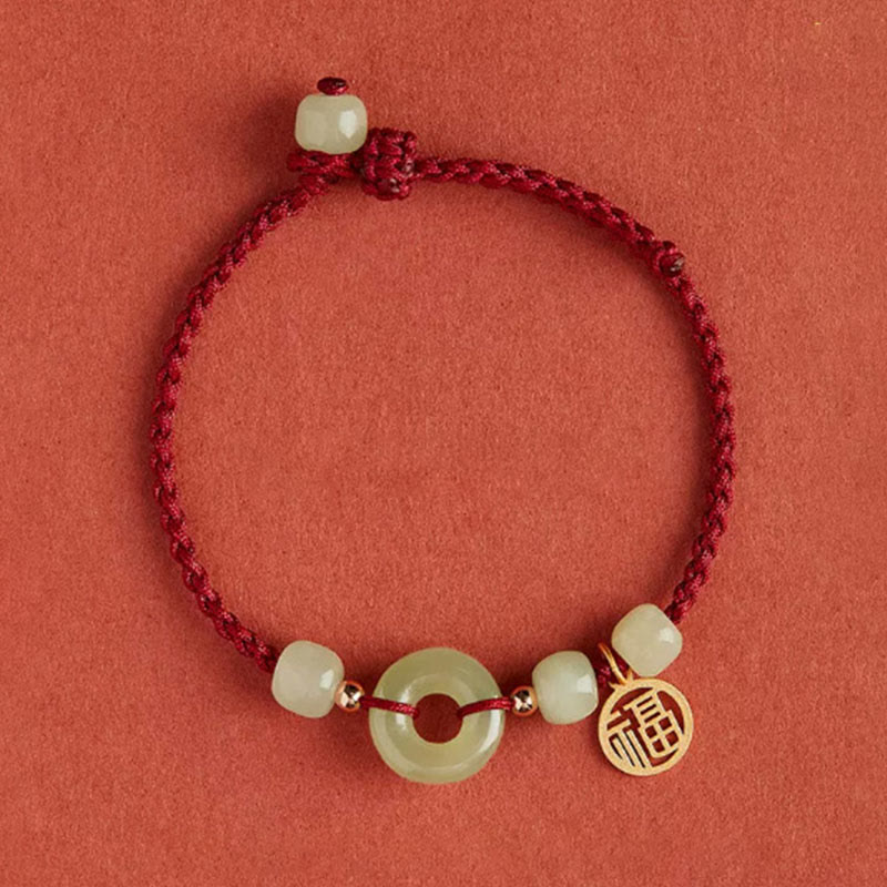 Bracelet en fil de jade et lotus de paix pour l'abondance