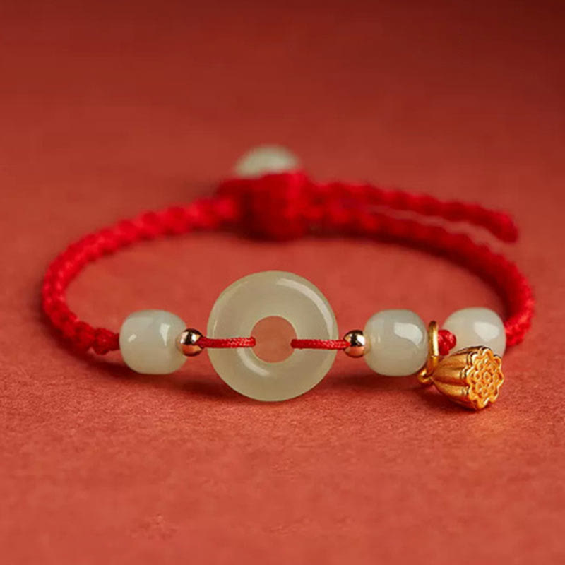 Bracelet en fil de jade et lotus de paix pour l'abondance