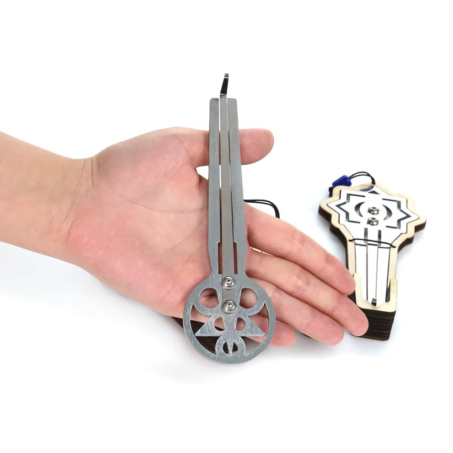 Metal butterfly knife trainer with circular design, featured in Jaw Harp Instrument E Major