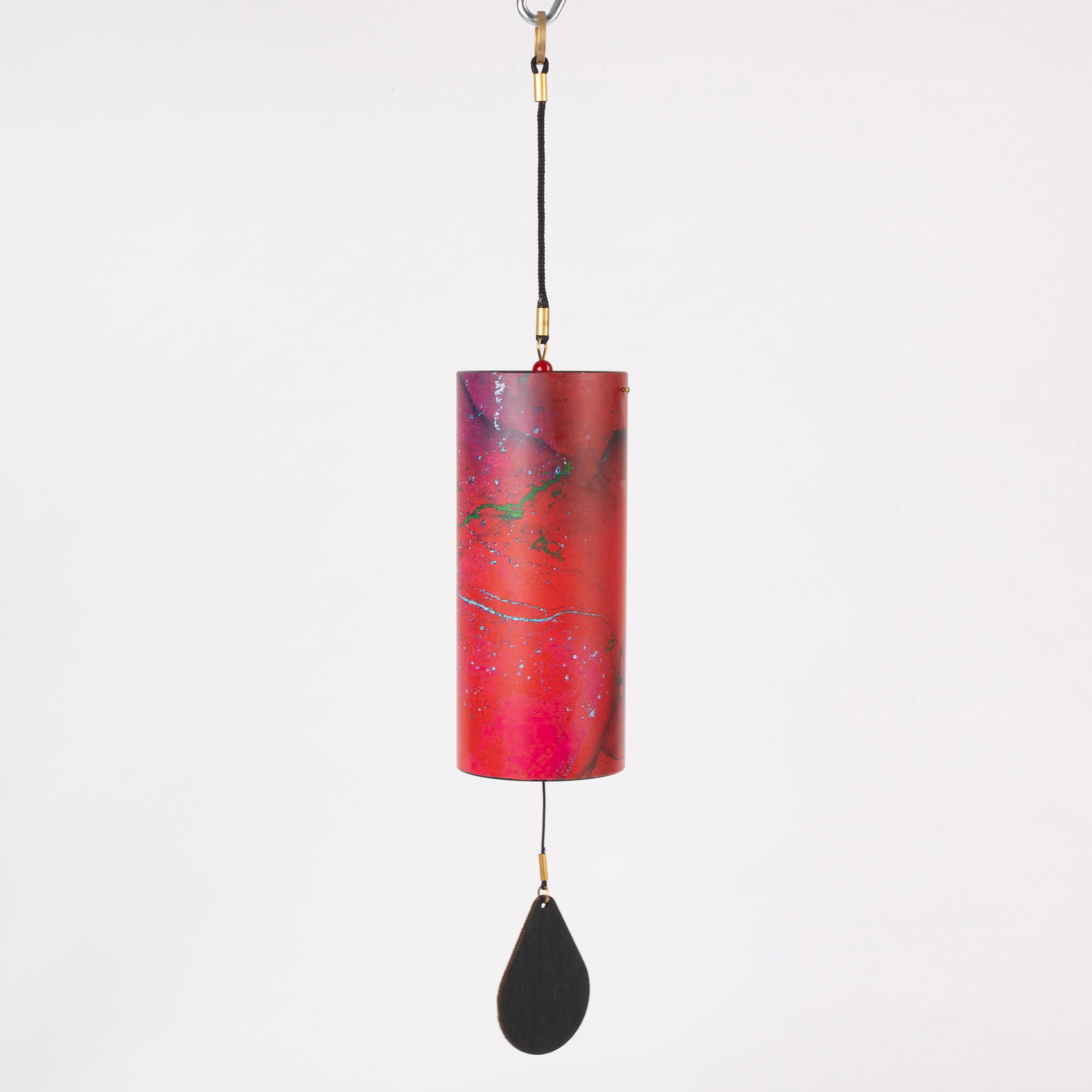 Red cylindrical wind chime with black teardrop pendant for meditation and sound healing