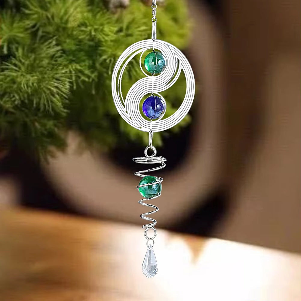 Wire-wrapped Yin Yang pendant with blue and green beads, crystal dangle on spinner