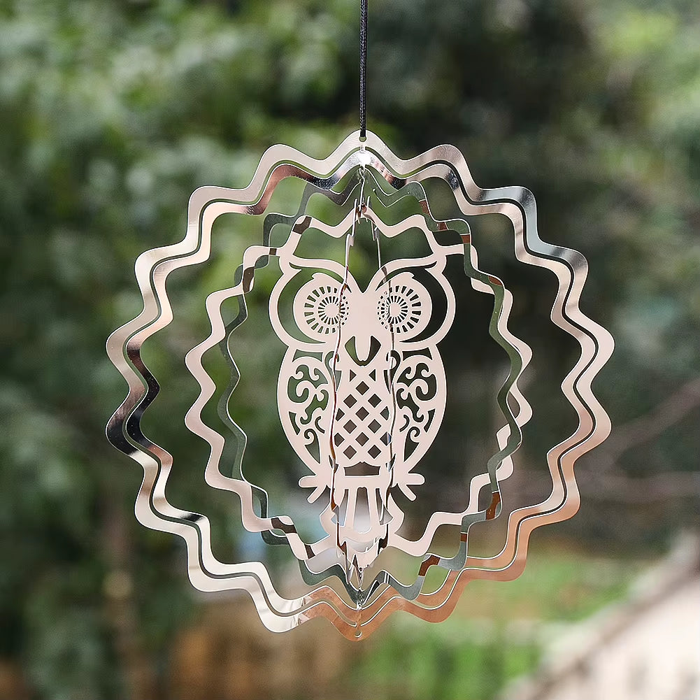 Metal wind spinner with owl design and spiral rings for decorative gardens