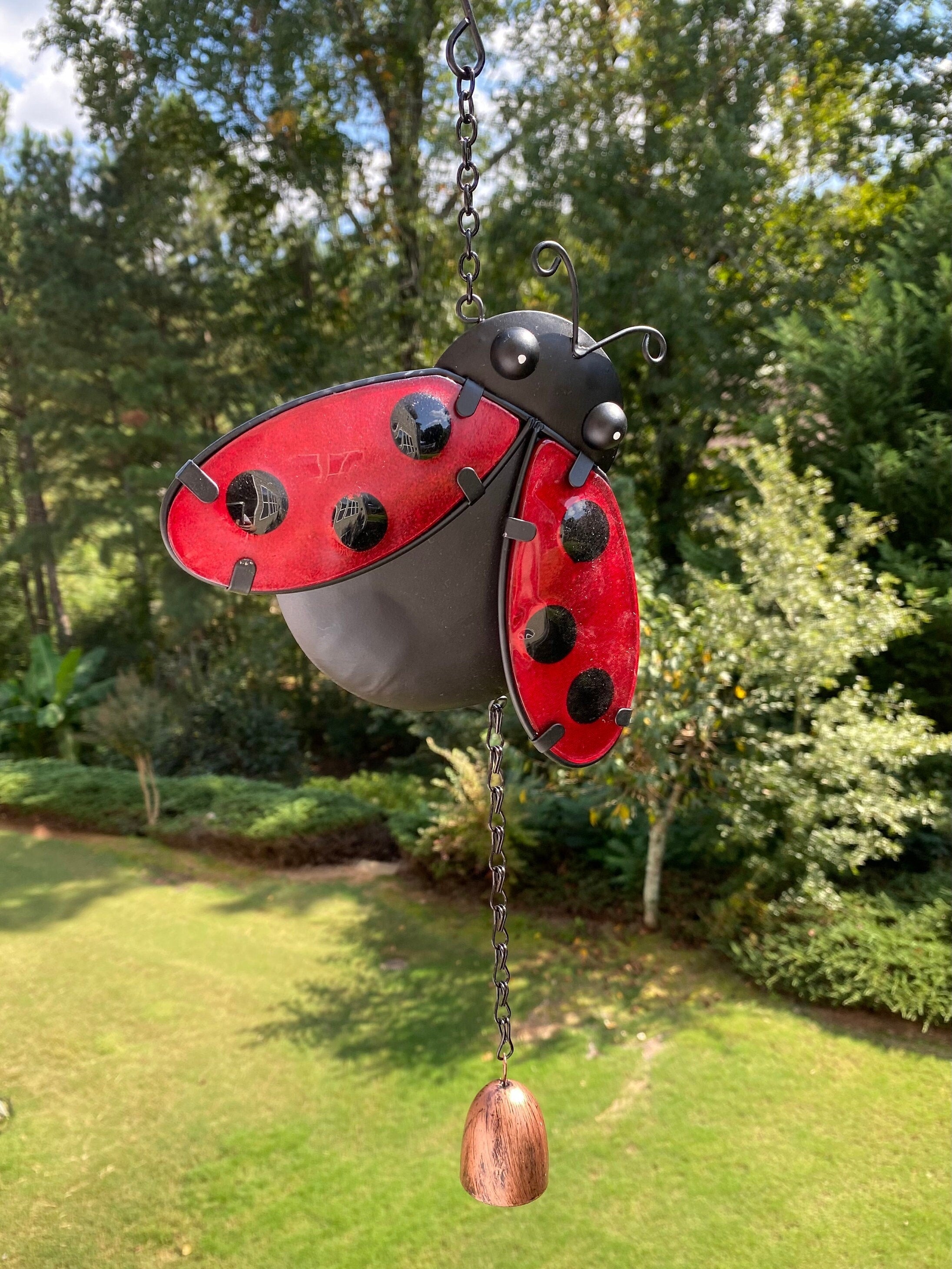 Red and black Metal Ladybug Wind Chime with decorative hanging bell for garden decor