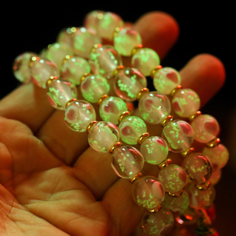 Bracelet spirituel en forme de cœur rose lumineux avec une bête avaleuse en or