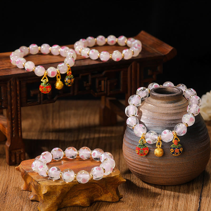 Bracelet spirituel en forme de cœur rose lumineux avec une bête avaleuse en or
