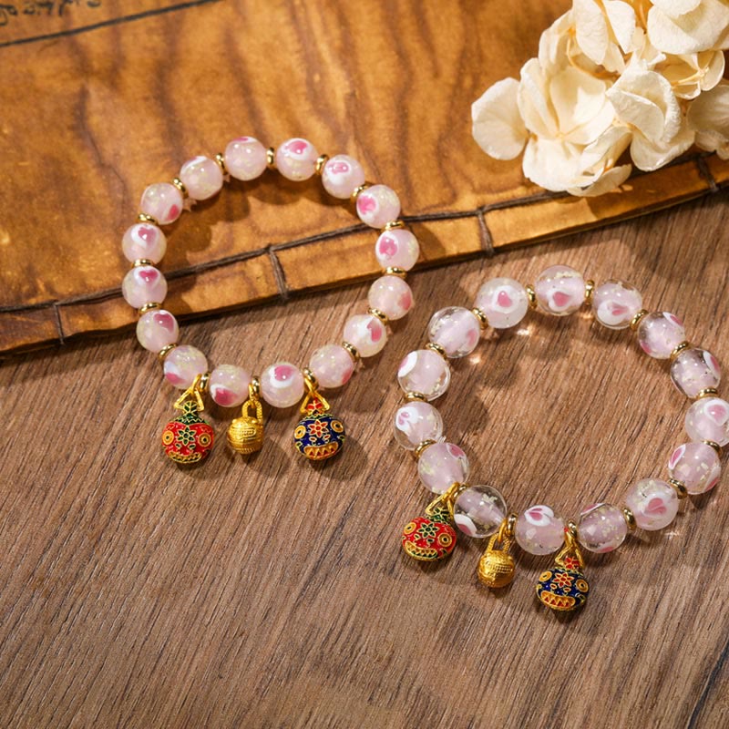 Bracelet spirituel en forme de cœur rose lumineux avec une bête avaleuse en or