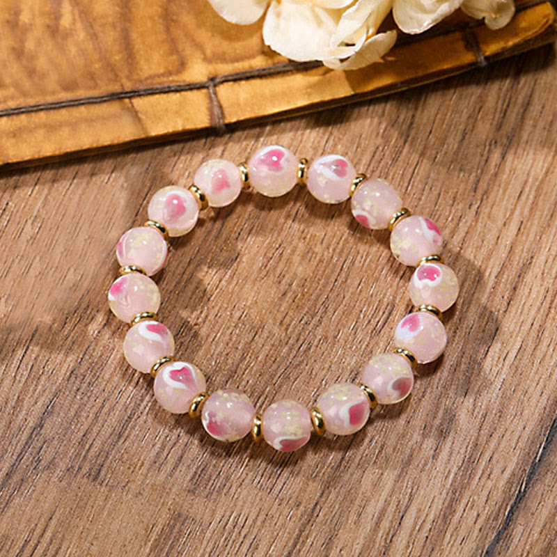 Bracelet spirituel en forme de cœur rose lumineux avec une bête avaleuse en or