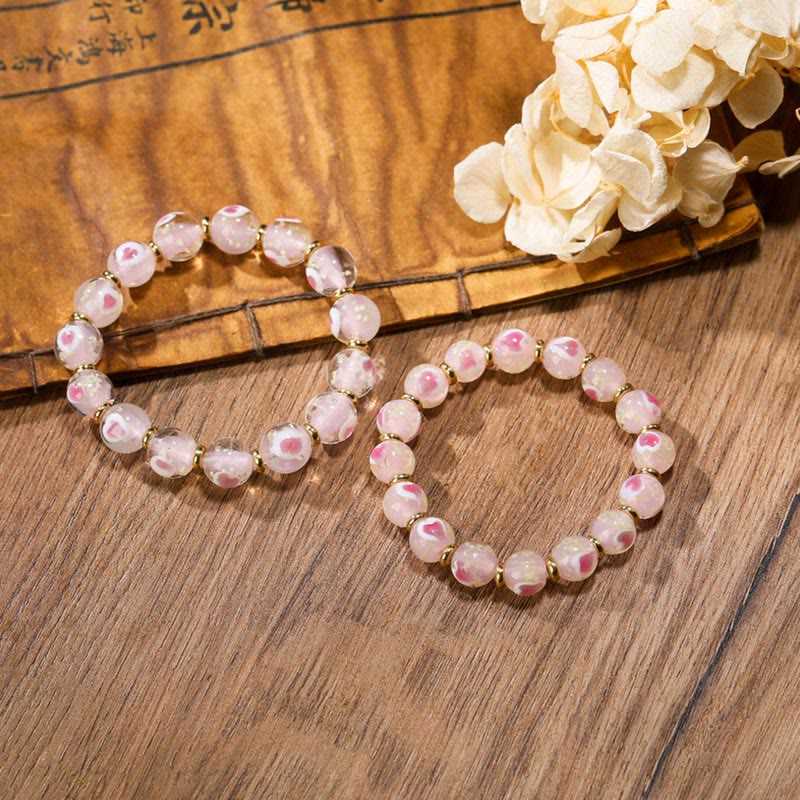 Bracelet spirituel en forme de cœur rose lumineux avec une bête avaleuse en or