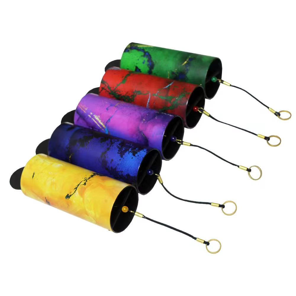 Colorful cylindrical bird feeders with hanging cords in a row near Metal Koshi Wind Chimes