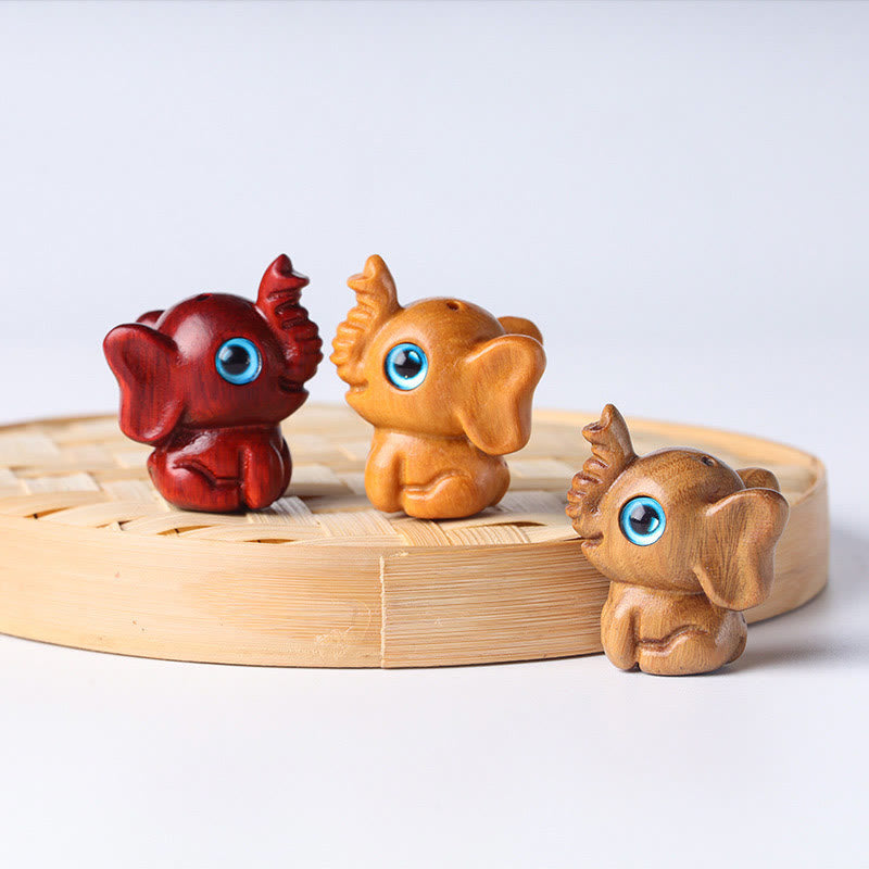 Mini éléphant sculpté en bois de santal pour la protection et la chance