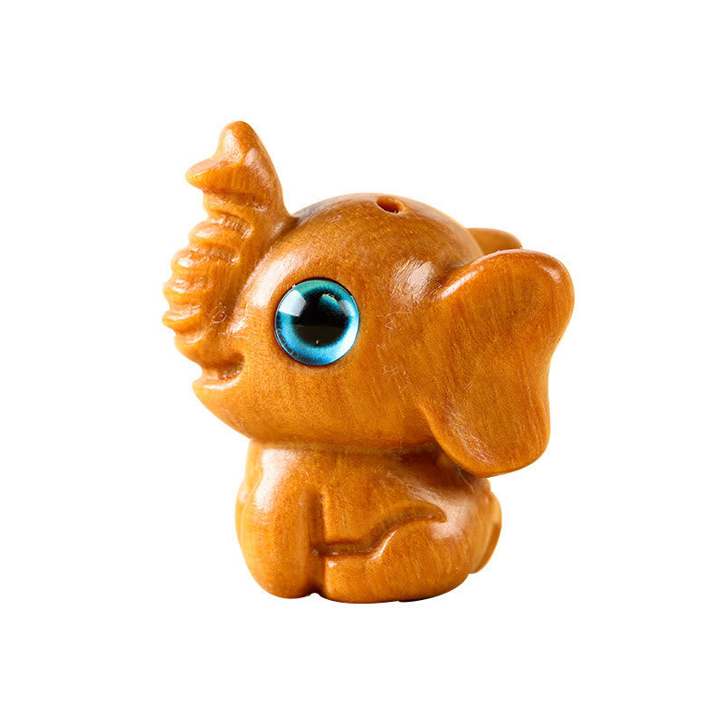 Mini éléphant sculpté en bois de santal pour la protection et la chance