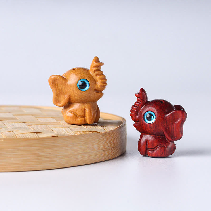 Mini éléphant sculpté en bois de santal pour la protection et la chance