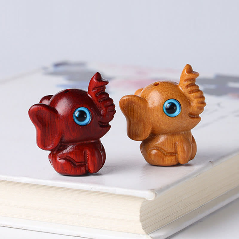 Mini éléphant sculpté en bois de santal pour la protection et la chance